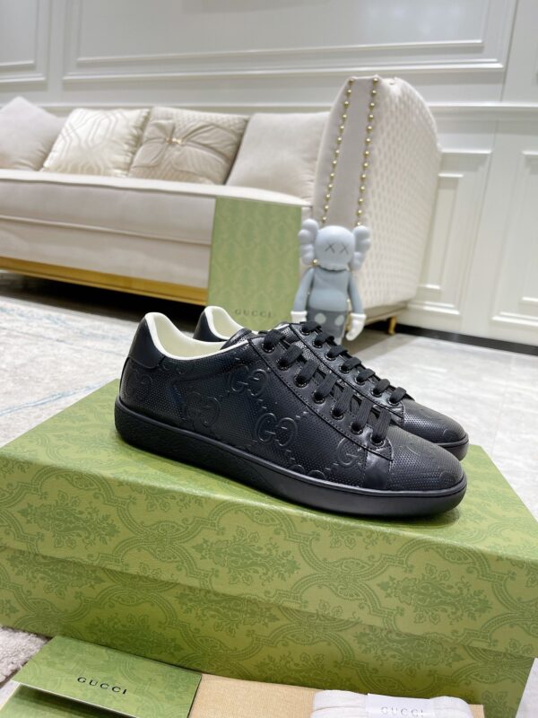 sy_no_02C19A4BC757D29C5B629F646AC1AFBC_0 Gucci Ace Black GG Embossed Leather Low-Top Sneakers