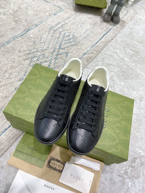 sy_no_02C19A4BC757D29C5B629F646AC1AFBC_1 Gucci Ace Black GG Embossed Leather Low-Top Sneakers