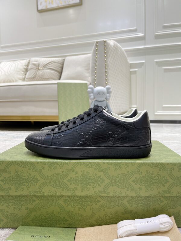 sy_no_02C19A4BC757D29C5B629F646AC1AFBC_2 Gucci Ace Black GG Embossed Leather Low-Top Sneakers
