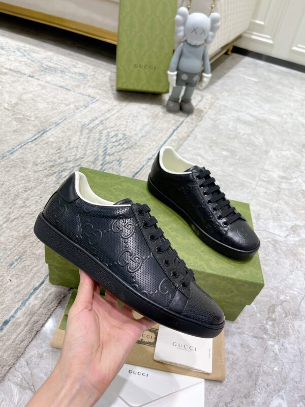 sy_no_02C19A4BC757D29C5B629F646AC1AFBC_4 Gucci Ace Black GG Embossed Leather Low-Top Sneakers