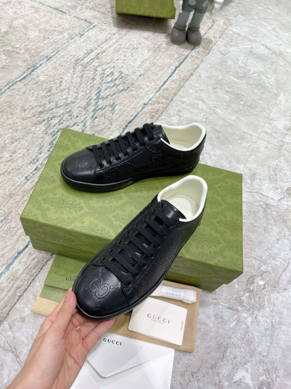 sy_no_02C19A4BC757D29C5B629F646AC1AFBC_5 Gucci Ace Black GG Embossed Leather Low-Top Sneakers