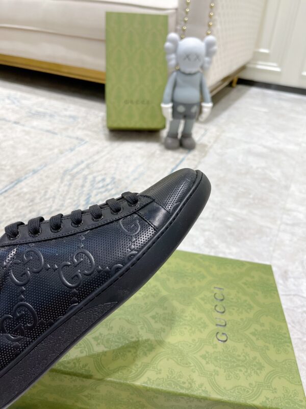 sy_no_02C19A4BC757D29C5B629F646AC1AFBC_7 Gucci Ace Black GG Embossed Leather Low-Top Sneakers