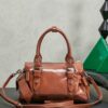 sy_no_066FA3D7F3DB043995F2A512C4596821_1 Miu Miu New Oiled-Wax Leather Bow Biker-Style Bag – Vintage, Spacious, Multi-Way Bag (Underarm, Shoulder, Crossbody, Handheld) – Brown