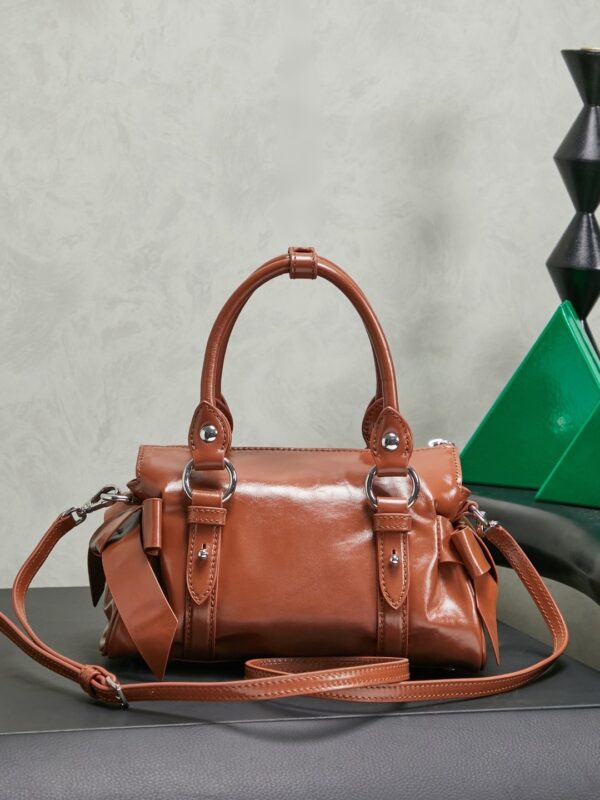 sy_no_066FA3D7F3DB043995F2A512C4596821_1 Miu Miu New Oiled-Wax Leather Bow Biker-Style Bag – Vintage, Spacious, Multi-Way Bag (Underarm, Shoulder, Crossbody, Handheld) – Brown