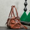 sy_no_066FA3D7F3DB043995F2A512C4596821_2 Miu Miu New Oiled-Wax Leather Bow Biker-Style Bag – Vintage, Spacious, Multi-Way Bag (Underarm, Shoulder, Crossbody, Handheld) – Brown