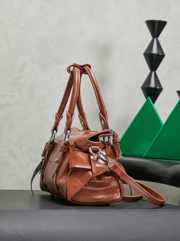 sy_no_066FA3D7F3DB043995F2A512C4596821_2 Miu Miu New Oiled-Wax Leather Bow Biker-Style Bag – Vintage, Spacious, Multi-Way Bag (Underarm, Shoulder, Crossbody, Handheld) – Brown
