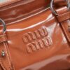 sy_no_066FA3D7F3DB043995F2A512C4596821_4 Miu Miu New Oiled-Wax Leather Bow Biker-Style Bag – Vintage, Spacious, Multi-Way Bag (Underarm, Shoulder, Crossbody, Handheld) – Brown