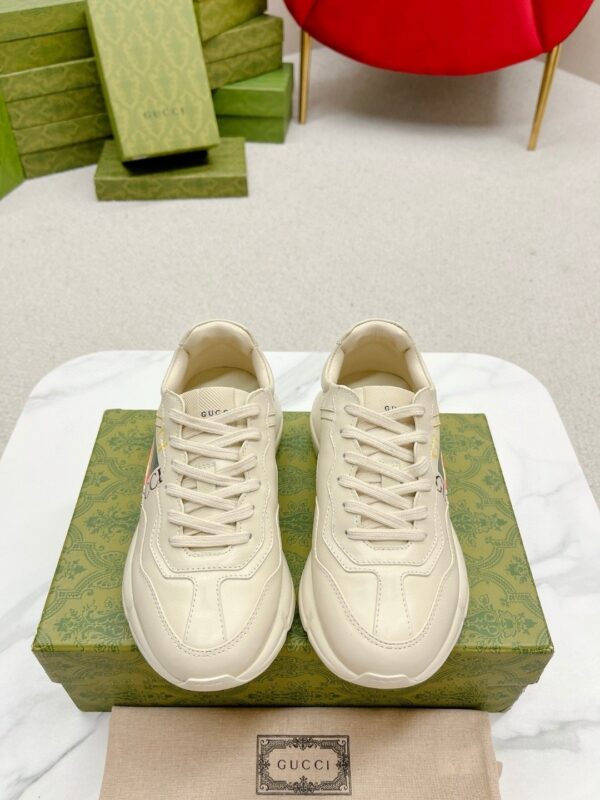 sy_no_19F5F11DD25788B415EEA81A5D3FE9D1_1 Gucci Rhyton Worldwide Vintage Logo Sneaker in Off-White Leather