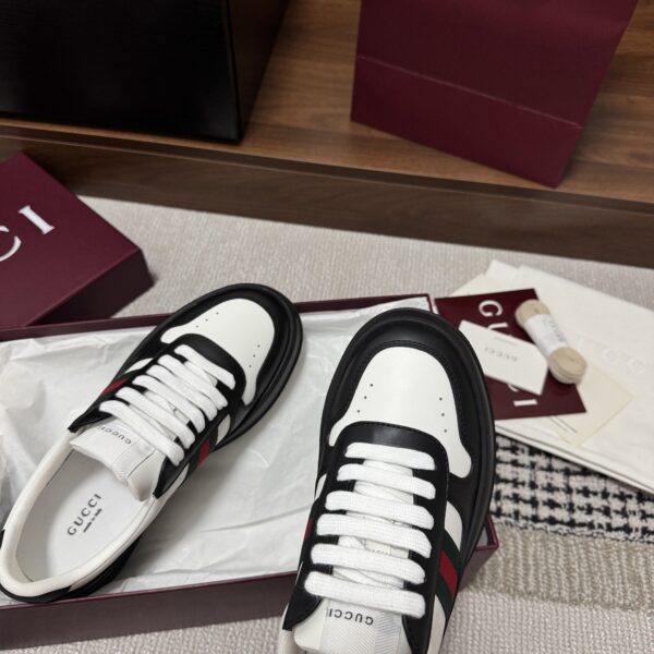 sy_no_21CB02F14890A04606235B99A25B5987_6 Gucci Re-Web Sneaker in Black & White Leather with Web Stripe
