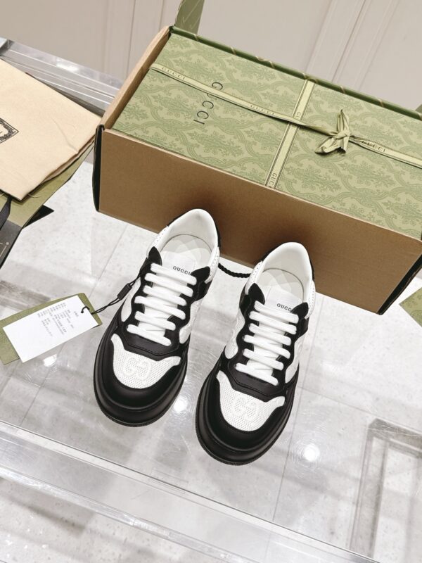sy_no_38AC2F3EBB547AAD23D568A99A434CA3_1 Gucci GG Embossed Leather Platform Sneaker – Black / White