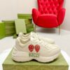 sy_no_38E11D82A9122100A41DA843EA6B6F7A_0 Gucci Rhyton Strawberry Print Sneaker – Ivory