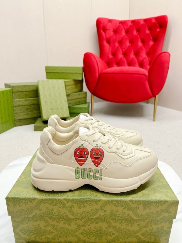 sy_no_38E11D82A9122100A41DA843EA6B6F7A_0 Gucci Rhyton Strawberry Print Sneaker – Ivory