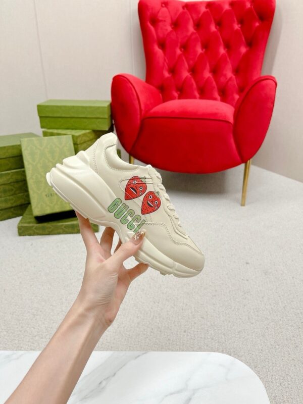 sy_no_38E11D82A9122100A41DA843EA6B6F7A_3 Gucci Rhyton Strawberry Print Sneaker – Ivory