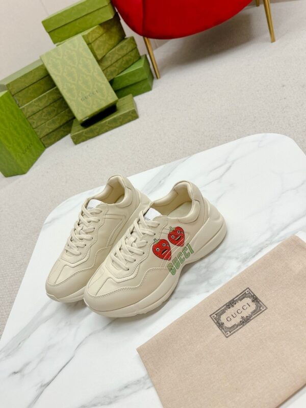 sy_no_38E11D82A9122100A41DA843EA6B6F7A_4 Gucci Rhyton Strawberry Print Sneaker – Ivory