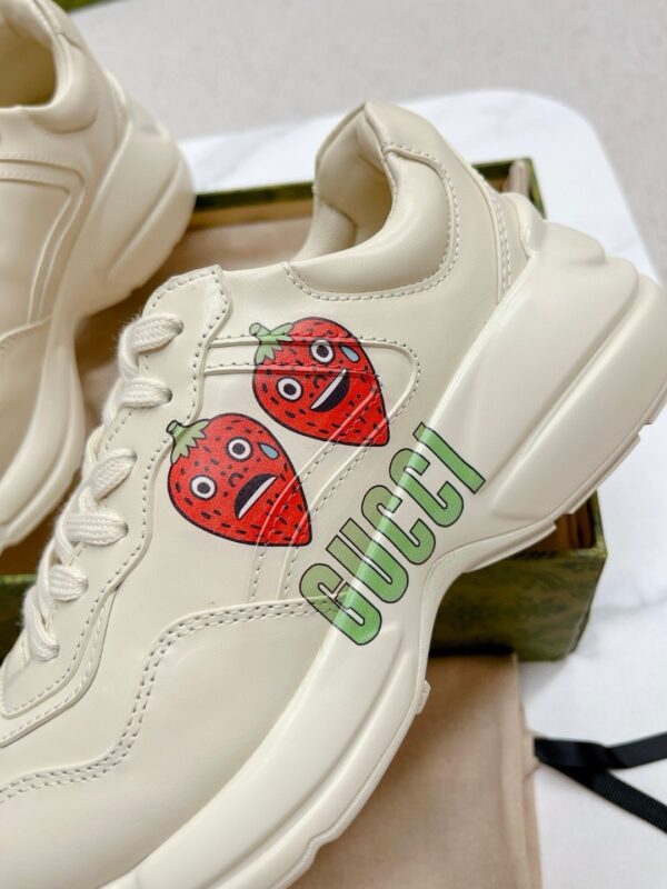 sy_no_38E11D82A9122100A41DA843EA6B6F7A_7 Gucci Rhyton Strawberry Print Sneaker – Ivory