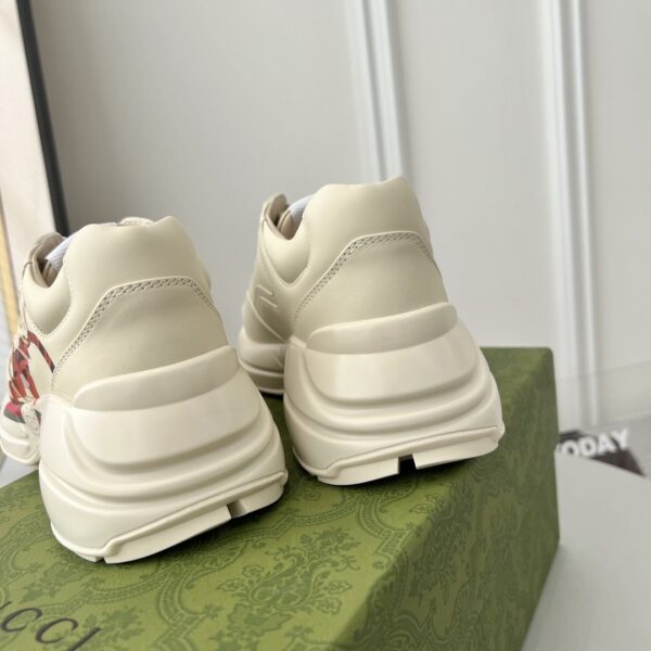sy_no_3B6147E7F520C3673A90A8324575F077_7 Gucci x Disney Rhyton “Tigger” Sneaker in Off-White