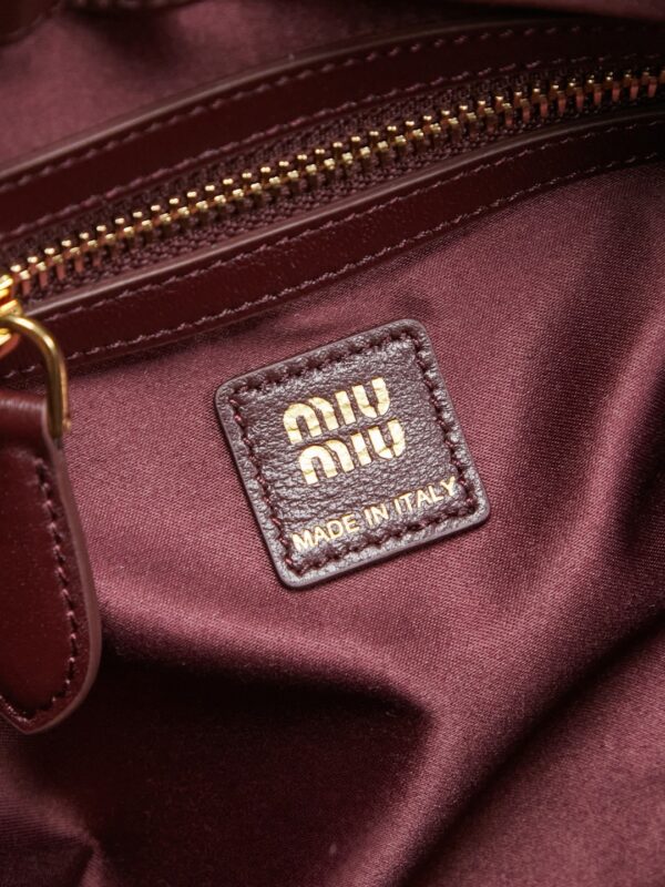 sy_no_3B81CB19F14FA4342AD0BB6B443F2F70_8 Burgundy Matelassé Shell Backpack