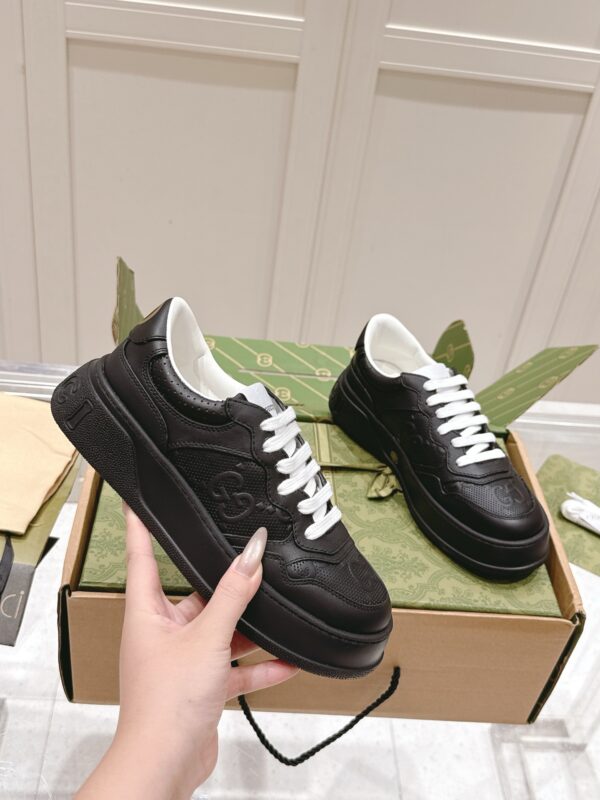 sy_no_4B1831A4BB6051906896D89506B985E7_0 Gucci GG Embossed Leather Platform Sneaker – Black / White