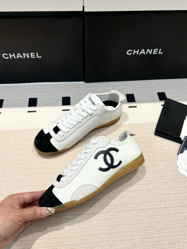 Chanel Low-Top Sneakers in Black & White