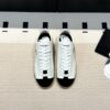 Chanel Low-Top Sneakers in Black & White