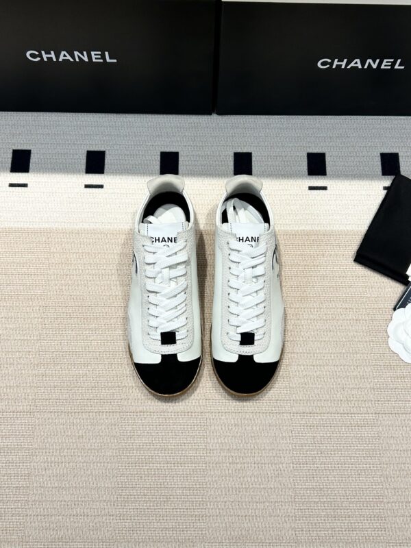 Chanel Low-Top Sneakers in Black & White