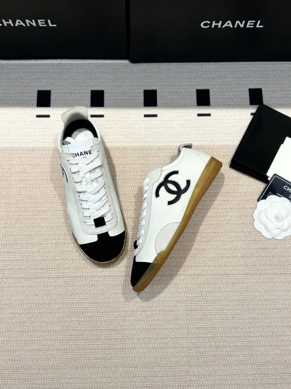 Chanel Low-Top Sneakers in Black & White