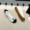 Chanel Low-Top Sneakers in Black & White