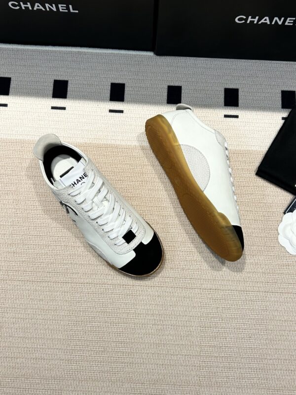 Chanel Low-Top Sneakers in Black & White