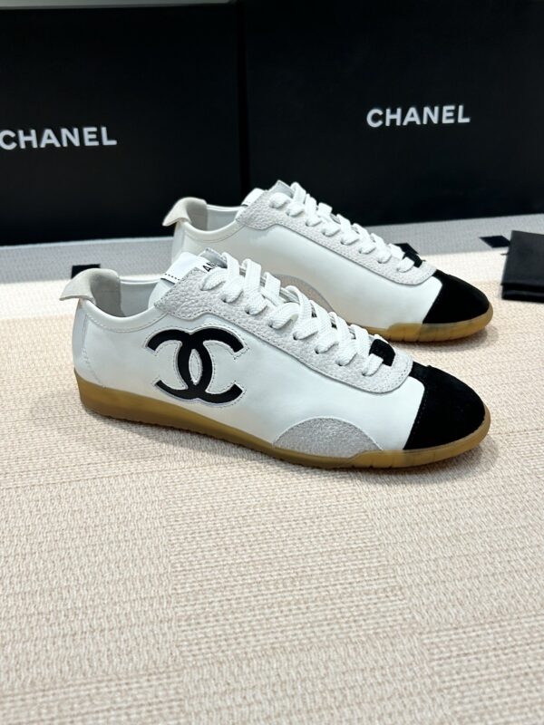 Chanel Low-Top Sneakers in Black & White