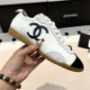 Chanel Low-Top Sneakers in Black & White