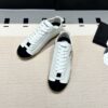 Chanel Low-Top Sneakers in Black & White