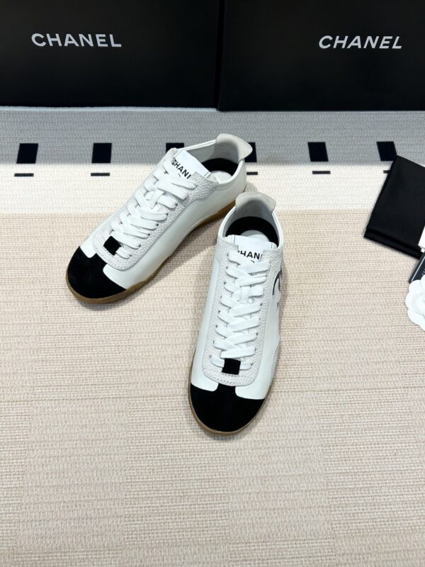 Chanel Low-Top Sneakers in Black & White