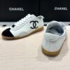 Chanel Low-Top Sneakers in Black & White