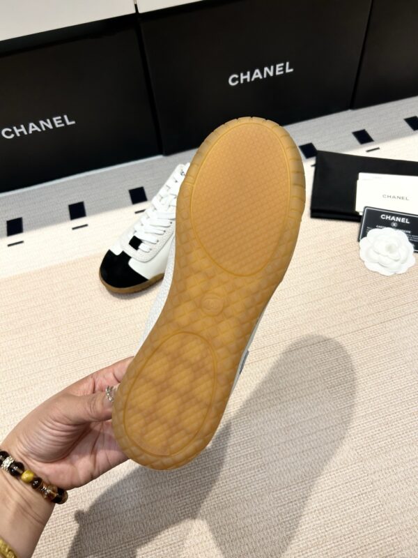 Chanel Low-Top Sneakers in Black & White