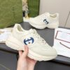 sy_no_61C110CC52F69EBD6044D3BF0BF10672_0 Gucci Rhyton Leather Sneaker in Off-White with Blue Interlocking G Logo