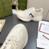 sy_no_61C110CC52F69EBD6044D3BF0BF10672_5 Gucci Rhyton Leather Sneaker in Off-White with Blue Interlocking G Logo