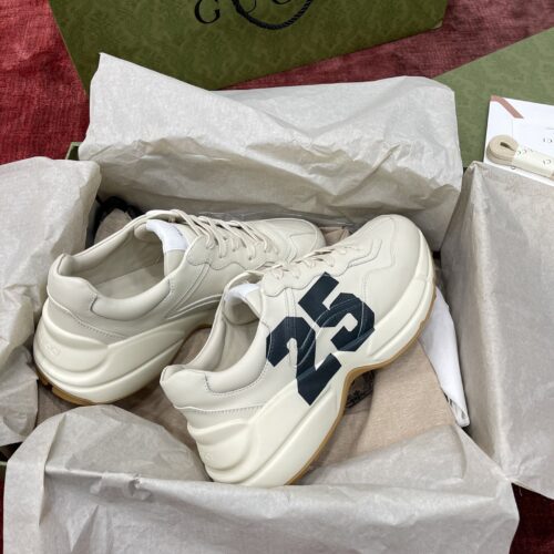 sy_no_627D806077E74C3578EE15D5D1F7D27D_0 Gucci Rhyton Ivory Leather “25” Print Chunky Sneakers