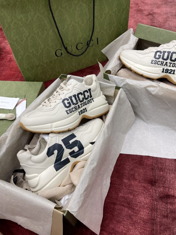 sy_no_627D806077E74C3578EE15D5D1F7D27D_2 Gucci Rhyton Ivory Leather “25” Print Chunky Sneakers