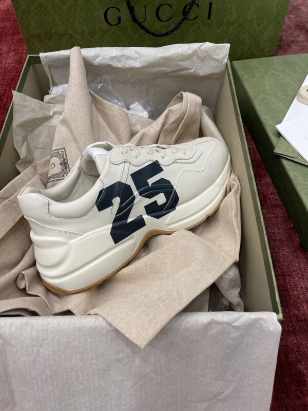 sy_no_627D806077E74C3578EE15D5D1F7D27D_5 Gucci Rhyton Ivory Leather “25” Print Chunky Sneakers