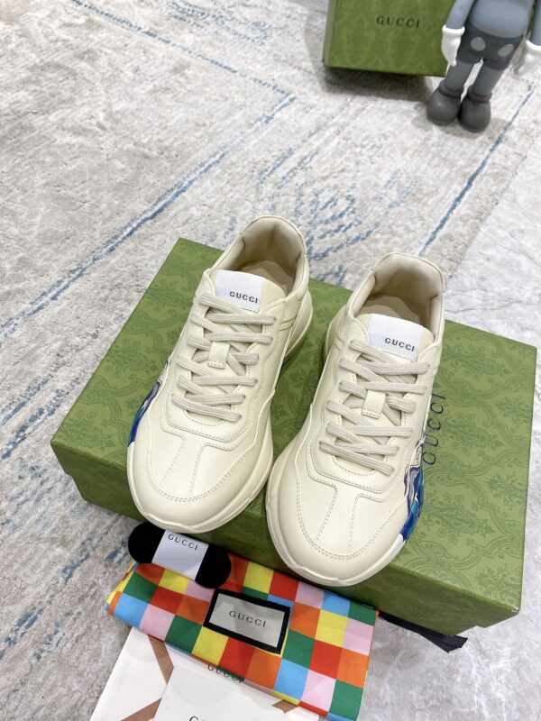 sy_no_64EE0CCBBA4ACEC7EB59A18A526629AB_1 Gucci Rhyton Ivory Leather Wave Print Chunky Sneakers