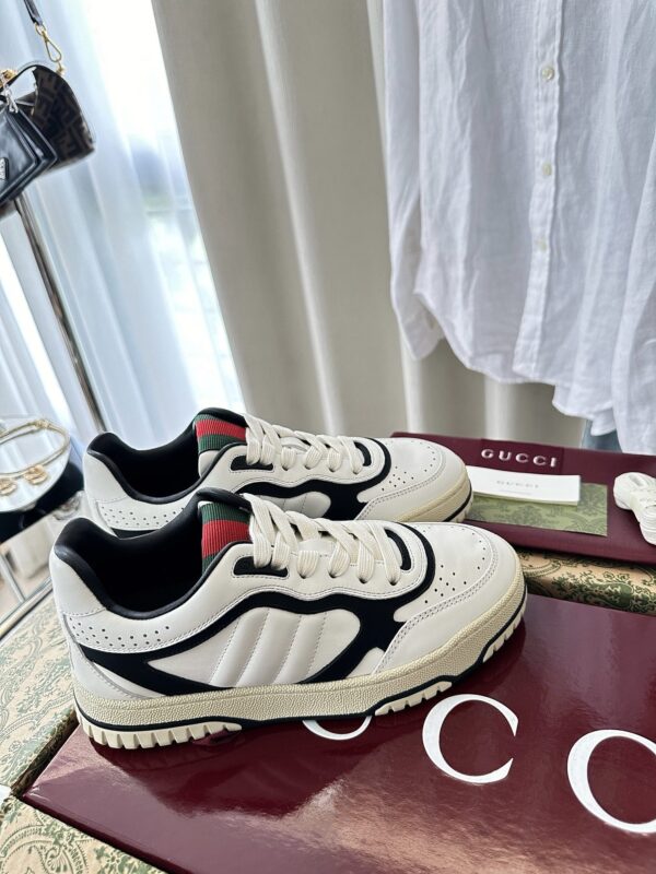 sy_no_777DF369D0ADB8D5F55D8B489BD13D14_2 Gucci B Leather Sneaker in White & Black