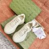 sy_no_7F5815E2E4EB510AFD17E649CF16BE46_0 Gucci Rhyton Leather Sneaker in Off-White with Black Interlocking G Logo