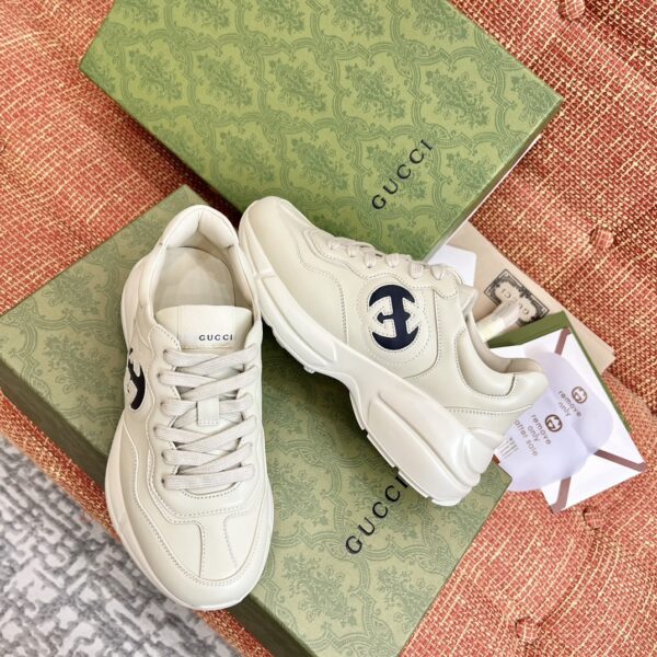 sy_no_7F5815E2E4EB510AFD17E649CF16BE46_3 Gucci Rhyton Leather Sneaker in Off-White with Black Interlocking G Logo