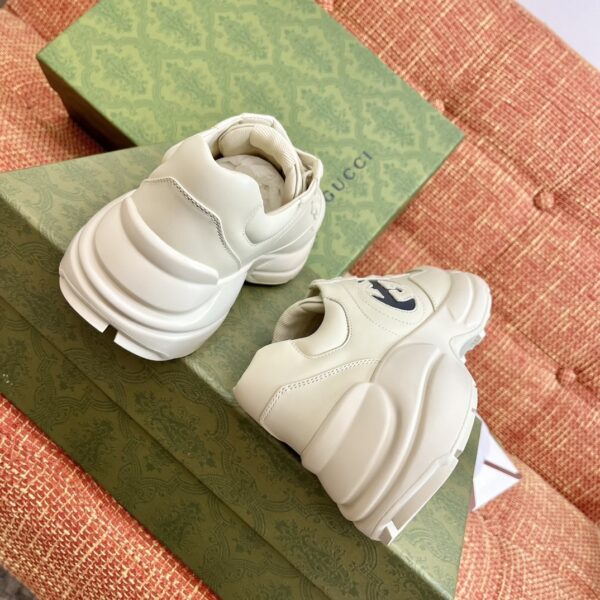 sy_no_7F5815E2E4EB510AFD17E649CF16BE46_5 Gucci Rhyton Leather Sneaker in Off-White with Black Interlocking G Logo