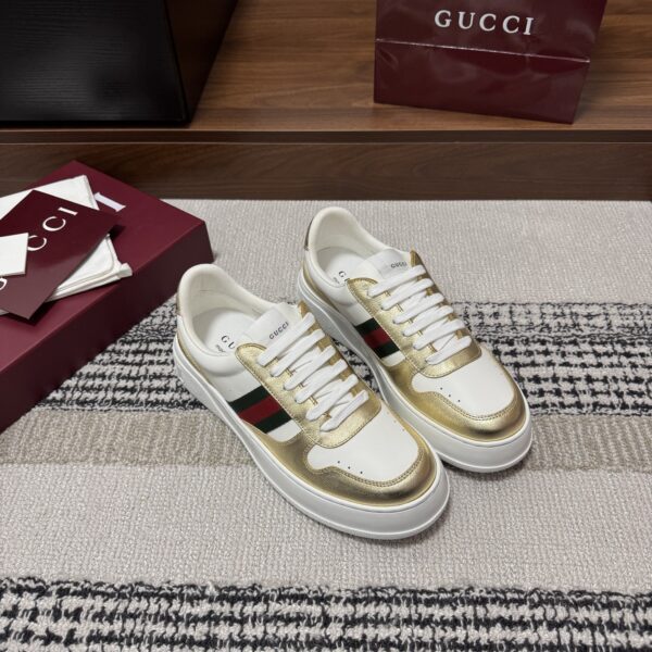 sy_no_86FA7790F9D44F194E522EA0D4CC5C71_0 Gucci Re-Web Sneaker in Metallic Gold & White Leather with Web Stripe