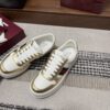 sy_no_86FA7790F9D44F194E522EA0D4CC5C71_1 Gucci Re-Web Sneaker in Metallic Gold & White Leather with Web Stripe