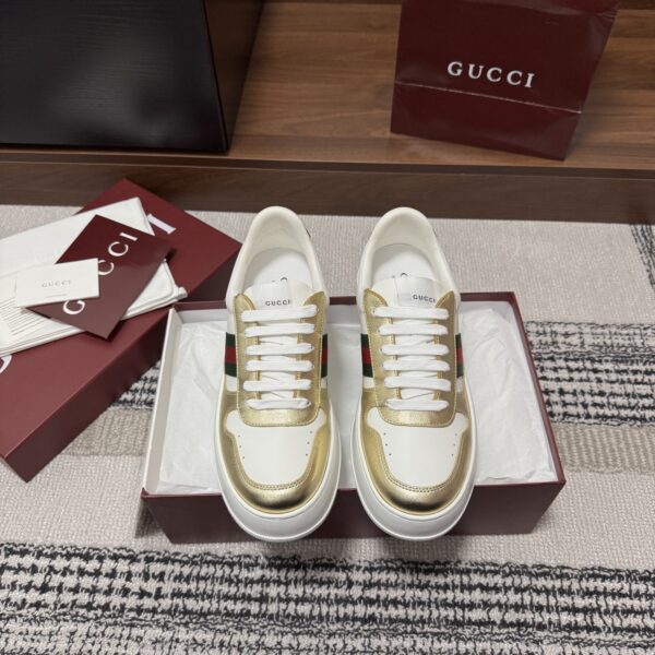 sy_no_86FA7790F9D44F194E522EA0D4CC5C71_2 Gucci Re-Web Sneaker in Metallic Gold & White Leather with Web Stripe