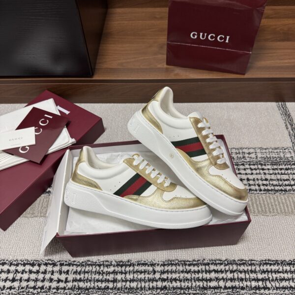 sy_no_86FA7790F9D44F194E522EA0D4CC5C71_3 Gucci Re-Web Sneaker in Metallic Gold & White Leather with Web Stripe