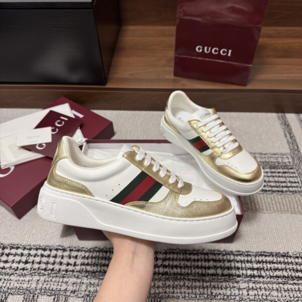 sy_no_86FA7790F9D44F194E522EA0D4CC5C71_4 Gucci Re-Web Sneaker in Metallic Gold & White Leather with Web Stripe