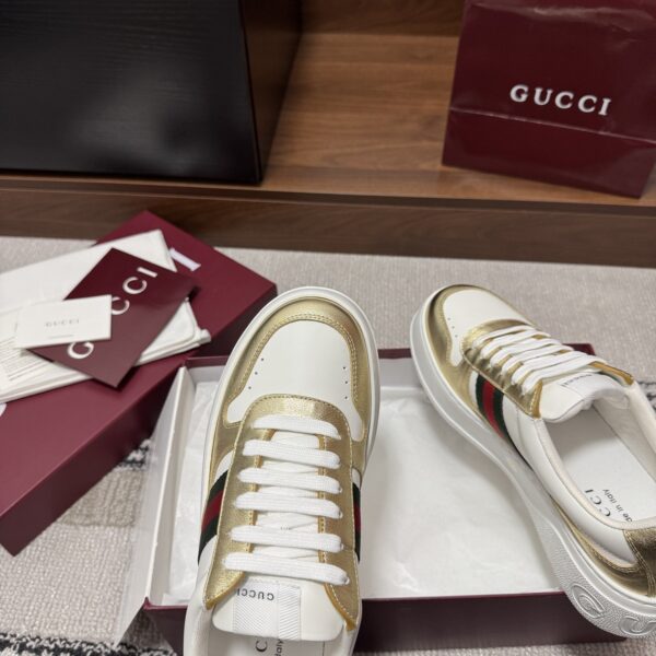 sy_no_86FA7790F9D44F194E522EA0D4CC5C71_6 Gucci Re-Web Sneaker in Metallic Gold & White Leather with Web Stripe